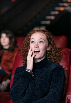 Movies: Teen Girl Watching A Scary Movie In Theater