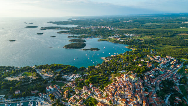 Fototapeta An aerial view of the beautiful old town of Vrsar, Croatia, captured by a drone. This charming coastal town features historic stone buildings, narrow winding streets, and a stunning view 