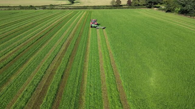 Aerial video of a tractor in the fields of Newport Berkeley in the UK
