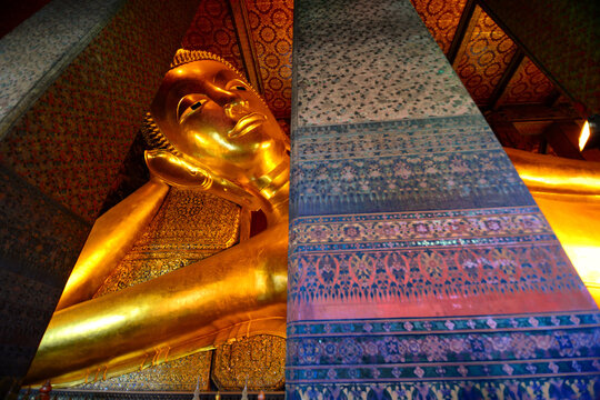 Largest golden reclining buddha (sleeping Buddha) statue sattle in  the huge buddhist temple (Wat Pho) Bangkok,Thailand.