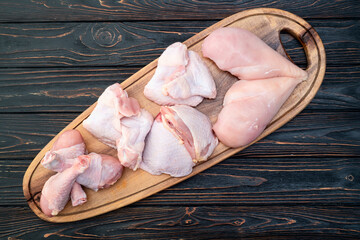 Raw mixed chicken meat parts  for cooking on rustic background