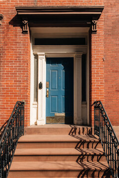 Blue Door on Brick Building