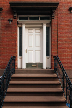 White Door on Red Brick Building