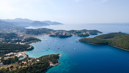 Obraz premium Syvota Greece. Aerial view of Sivota sandy beaches and islands, summer vacation destination in Epirus Ionian coast. Aerial view of iconic paradise sandy beaches with turquoise sea in complex islands