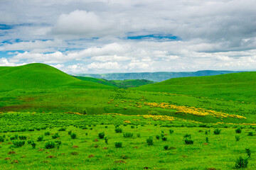 Obraz premium Picturesque green hills in cloudy weather. Caucasus