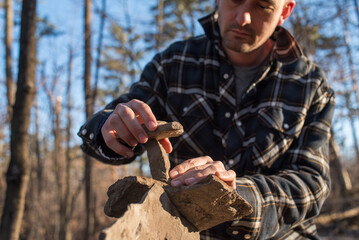 Hands stacking stones outdoor activity