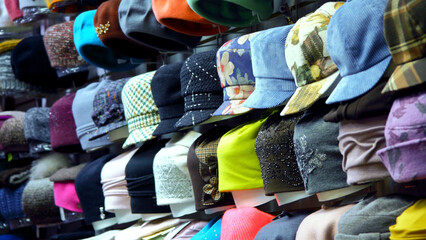 A headdress on a supermarket window.buy a lot of hats, draft caps.They are worn on the head by men and women for beauty