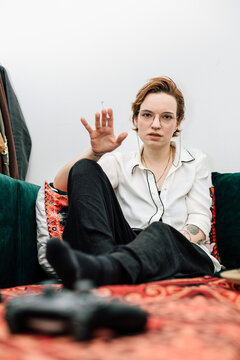 Woman Relaxing on Couch with a Cigarette