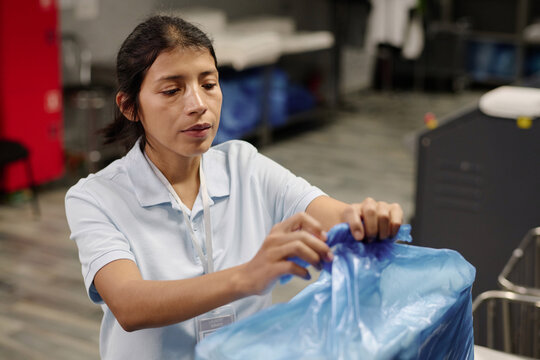 Woman Packing Linen At Work