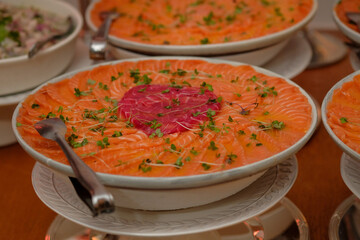 table with food, table setting, food, seafood buffet, salmon carpaccio, buffet, restaurant, thai food in a restaurant, table with snacks, varied dishes with salmon
