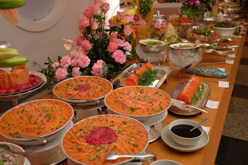 table with food, table setting, food, seafood buffet, salmon carpaccio, buffet, restaurant, thai food in a restaurant, table with snacks, varied dishes with salmon

