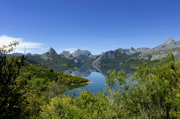 Beautiful panoramic view of the Riaño reservoir on a summer afternoon