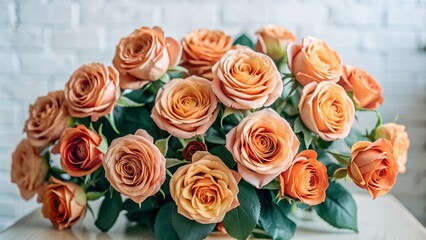 Naklejka premium Bouquet of Peach Roses Against a White Brick Wall in Soft Light