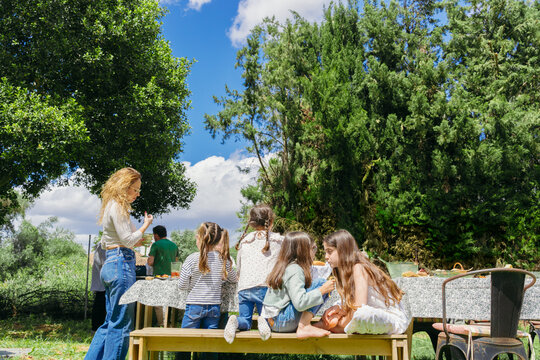 Group enjoying outdoor meal together

