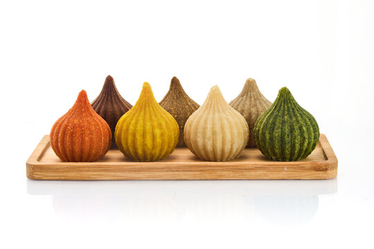 Ganesh Chaturthi Festival. Colorful Modaks Indian sweet dumpling on Plate