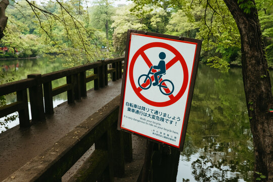 Warrning public sign - it is very dangerous to ride bicycle here 