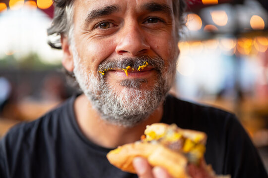 Crop man with hot dog