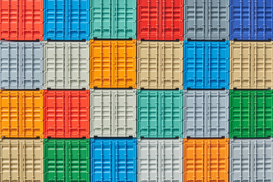 Stacked shipping containers ready for transportation in warehouse