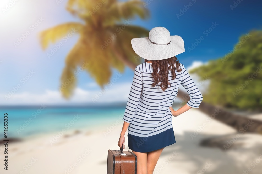 Canvas Prints Young woman sunbathing in front blue sea at vacation day