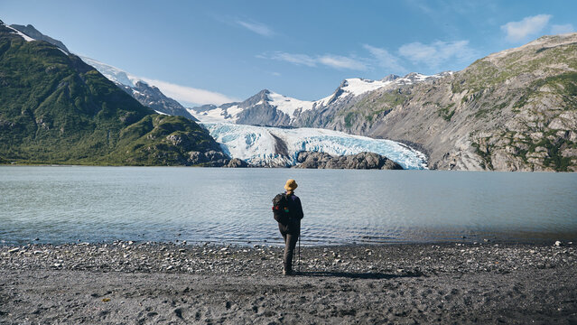 Alaska hiker in front of lake and glacier 