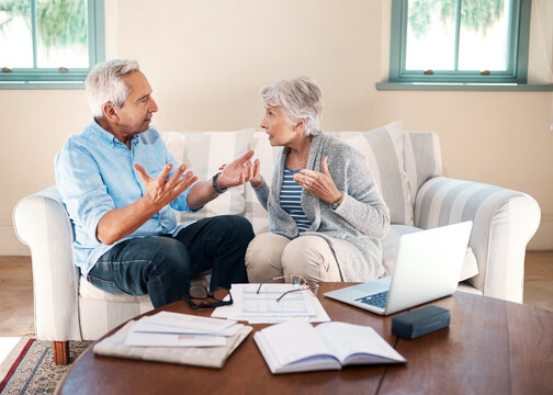 Fighting, old couple and laptop for finance, conflict and argument with gambling debt. Angry, pc and documents with man, woman and home loan with inflation, bankruptcy and frustrated with expenses