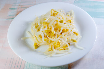 soybean sprouts on a white plate close-up