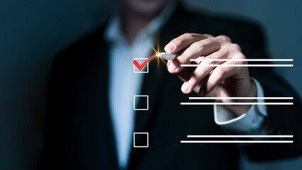 Checklist concept, Survey form concept. Questionnaire with checkboxes, filling survey form online, answer questions of test. Businessman use smartphone to check mark on check box on virtual screen © Montri