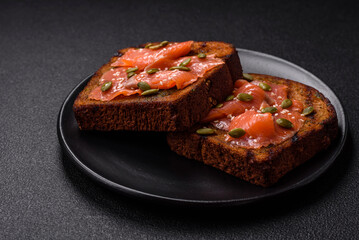 Sandwich or bruschetta with toast, salmon, cream cheese