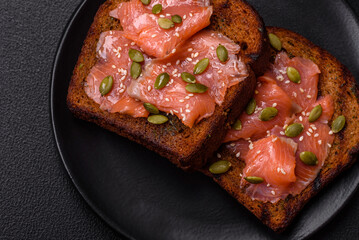 Sandwich or bruschetta with toast, salmon, cream cheese