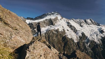 Rocky Path Through Snowy Mountains