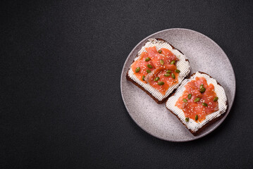 Sandwich or bruschetta with toast, salmon, cream cheese