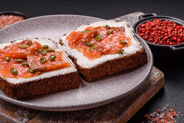 Sandwich or bruschetta with toast, salmon, cream cheese