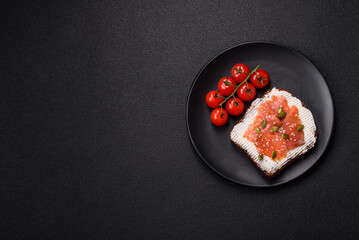 Sandwich or bruschetta with toast, salmon, cream cheese
