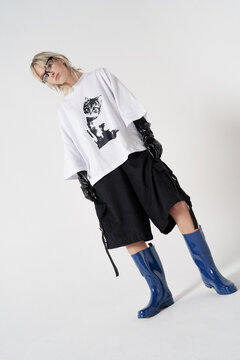 High rain boots, posing on white background