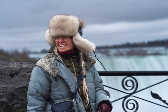 Happy senior woman traveling to Niagara Falls