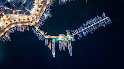 Night time top down aerial view of Adamantas, Greece