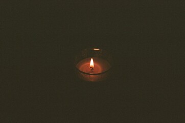 Candle in darkness