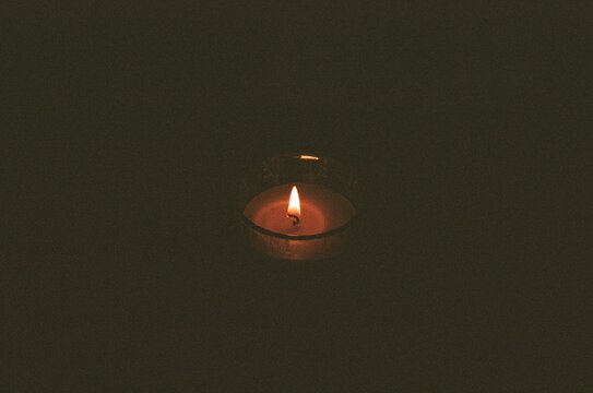 Candle in darkness