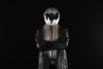portrait of biker in silver helmet on black background