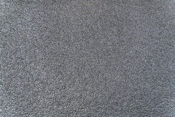 New wet asphalt texture. A frame filled with the textured surface of dry asphalt, showcasing the detailed pattern after rain