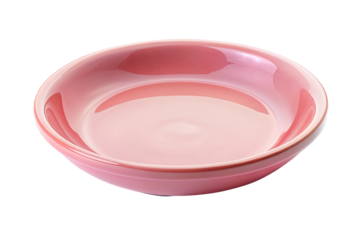 Pink ceramic plate with a smooth finish isolated on a transparent background.