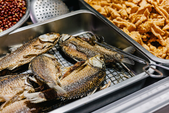 Fried Fish and Crispy Snacks at Market Stall