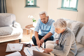 Fototapeta premium Old couple, paperwork and investment with policy summary elderly husband and wife on couch in home. Planning, report or senior people reading retirement savings growth, insurance fund or documents