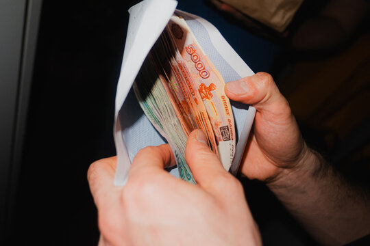 Counting Money Cash In Paper Envelope