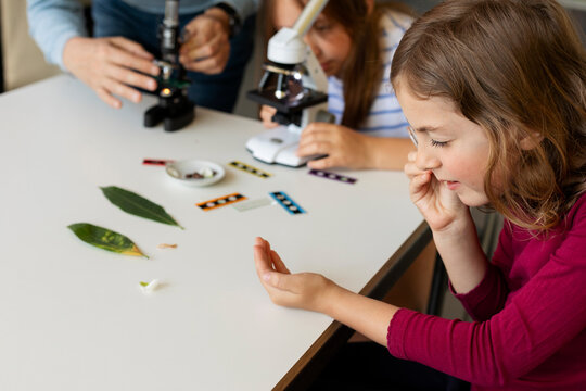 young girls doing experiments