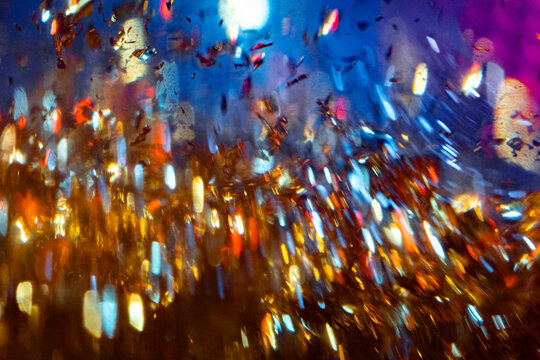 A bright dynamic abstraction of shiny metallic particles with a glass 