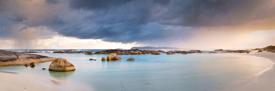 Evening storm over picturesque bay of water