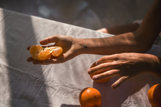 Hand holding citrus slices 
