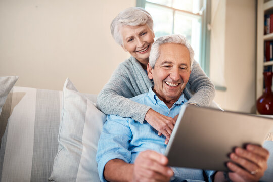 Happy old couple, tablet and results on investment app with smile or banking profit review in home. Hug, senior and elderly people reading online retirement savings, insurance growth or news update