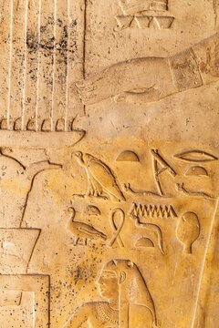 Ancient Egyptian hieroglyphics on stone wall, cultural heritage